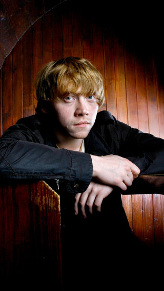 Young man wooden wall serious - fantastic realism free wallpaper for mobile