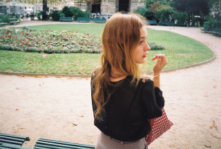 Woman park bench eating food - a piece of food free wallpaper