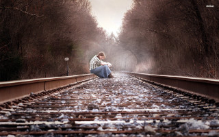 Woman sitting train track woods 2 - her phone free wallpaper