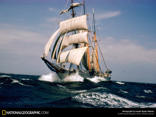 Sailboat sailing ocean sunny day - photoreal free wallpaper