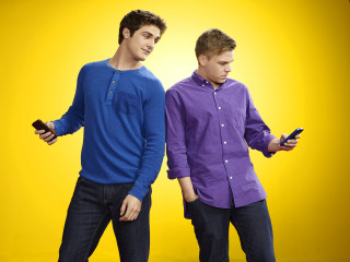 Young men holding cell phones - young free wallpaper for desktop