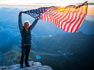 Woman american flag mountain sunset - an american flag free wallpaper