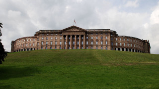 Large building hill flag flagpole - grotesque free wallpaper