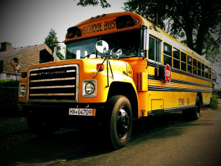 Yellow school bus road house - free retro wallpaper