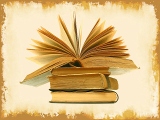 Pile of books on table - a wallpaper free wallpaper