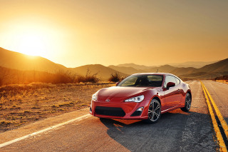 Red sports car sunset mountains 5 - a yellow line free wallpaper