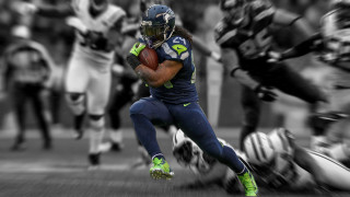 Football player running with ball 11 - a football player running free wallpaper
