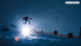 Snowboarder jumping ramp snow night - a snowboarder free wallpaper