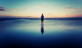 Beach sunset reflection person standing 2 - liminal space free wallpaper