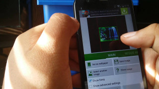 Person holding cell phone picture 3 - a person holding free wallpaper for desktop