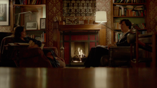 Couple sitting living room fireplace - a living room next free wallpaper