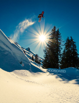 Snowboarder air snowy hill trees - a snowboard free wallpaper for mobile