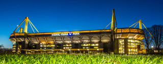 Stadium grassy field lit building - adriaen isenbrant free wallpaper