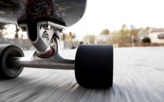 Skateboarder riding street wheels down - the board free wallpaper