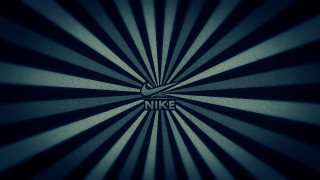 Nike logo dark background sunburst - a nike logo free wallpaper for desktop