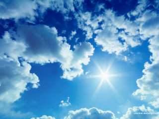 Bright sky clouds sunbeam cityscape - free sky wallpaper