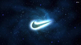 Black blue nike logo galaxy 2 - a blue light in the middle free wallpaper