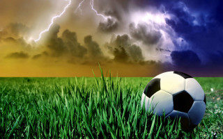 Soccer ball grass storm cloud 2 - a lightning bolt free wallpaper