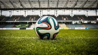 Soccer ball green field stadium 4 - a stadium free wallpaper