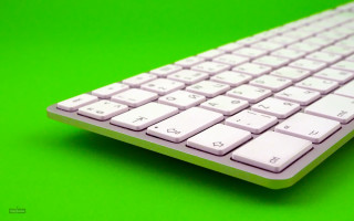 White keyboard green background outdoors - a green surface free wallpaper