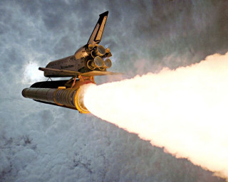 Space shuttle flying smoke landing - a space shuttle free wallpaper