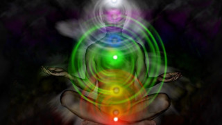Person sitting lotus chakra light - their body free wallpaper