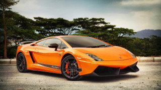 Bright orange sports car parking 8 - vibrant color free wallpaper