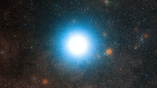 Bright blue object dark sky - free stars wallpaper