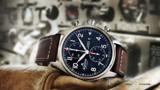 Watch gloved hand wall clocks - front of a wall free wallpaper