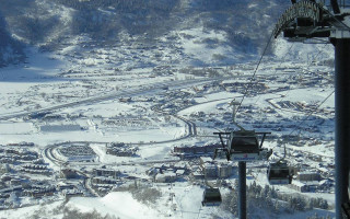 Ski lift snowy mountain town - zenith view free wallpaper