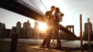 Man woman bridge sunshine city - a city skyline in the background free wallpaper for desktop
