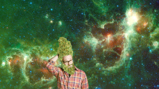 Man holding green stuff large - cosmic free wallpaper