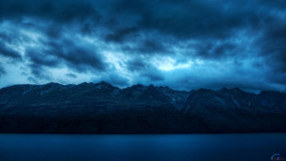 Mountain range water cloudy sky 2 - dark atmosphere free wallpaper