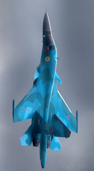 Blue fighter jet cloudy sky - free airplane wallpaper for mobile