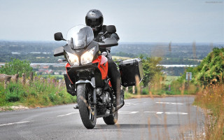 Motorcycle ride road field hill - a person riding free wallpaper