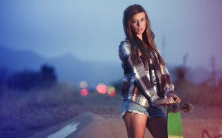 Woman holding skateboard road night - a skateboard free wallpaper