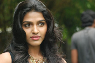 Woman long hair necklace looking - a man in the background free wallpaper