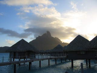 Pier thatched huts mountain clouds - hut free wallpaper for desktop