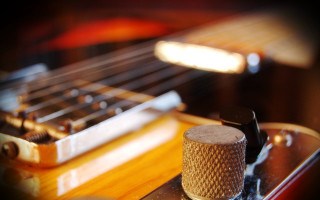 Guitar fretset pickup knobs closeup - free light wallpaper