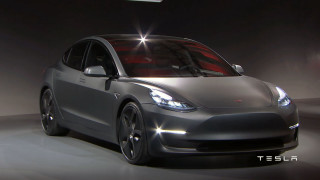 Silver tesla car dark room - a spotlight free wallpaper