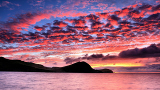 Sunset water mountains clouds boat - a sunset over a body of water free wallpaper