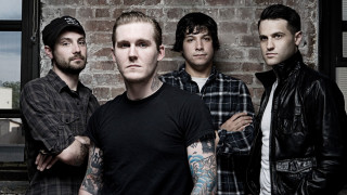 Men group brick wall window - a brick wall behind them free wallpaper