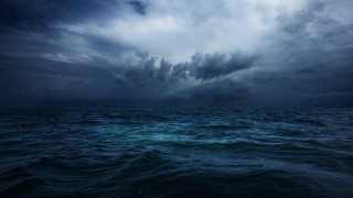 Dark sky ocean clouds boat - a few cloud above free wallpaper