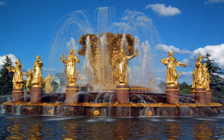 Fountain golden statues blue sky - gaudy free wallpaper