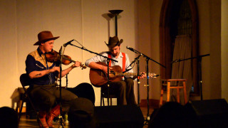 Two men playing instruments stage - stage free wallpaper