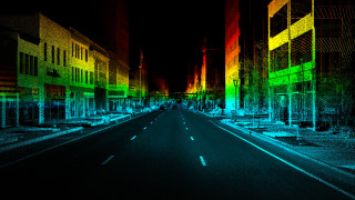Long empty street rainbow building - the background and a street light in the foreground free wallpaper