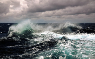 Large wave breaking ocean cloudy 3 - a small boat free wallpaper