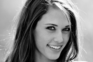 Woman long hair smiling camera 10 - headshot free wallpaper