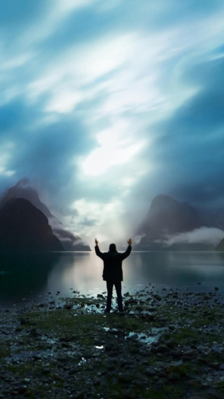 Man beach arms up mountains - david boyd free wallpaper for mobile