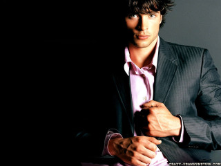 Man in suit holding tie 2 - a tie free wallpaper